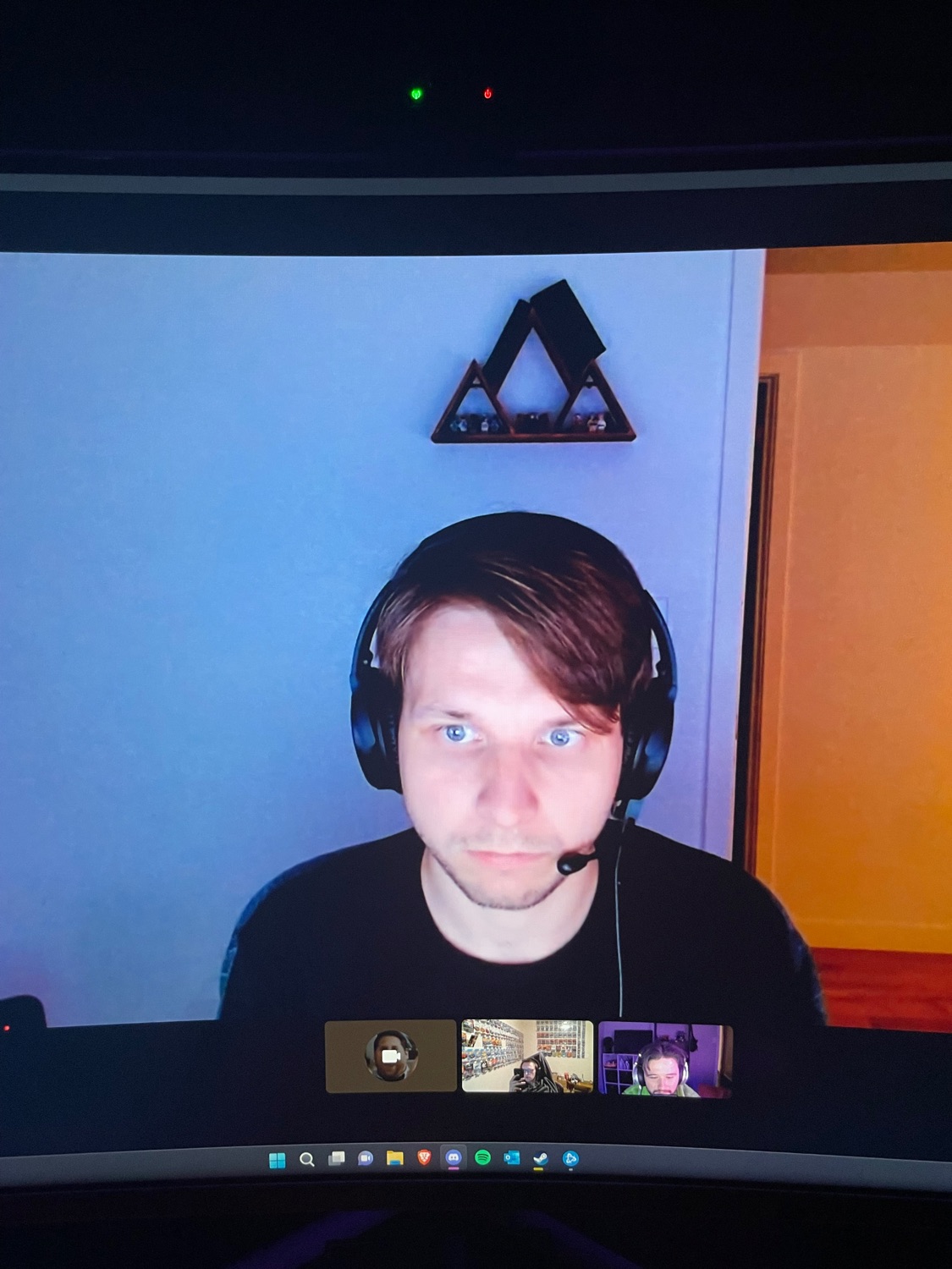 Luc conducting a remote consultation in headphones